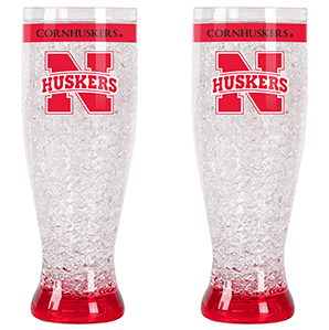 Two tall crystal glasses with cornhuskers on it