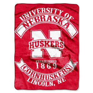blanket white and red with university of Nebraska huskers on it